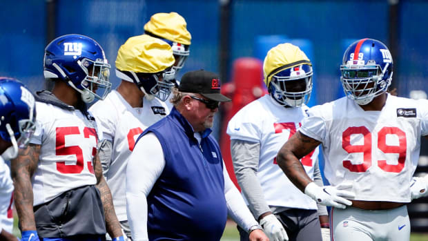 New York Giants defensive coordinator Don \"Wink\" Martindale walks on the field with the defense during mandatory minicamp at the Quest Diagnostics Training Center on Tuesday, June 7, 2022, in East Rutherford.